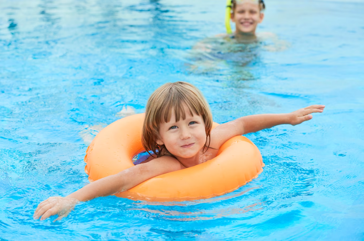 kids enjoy in swimming pool